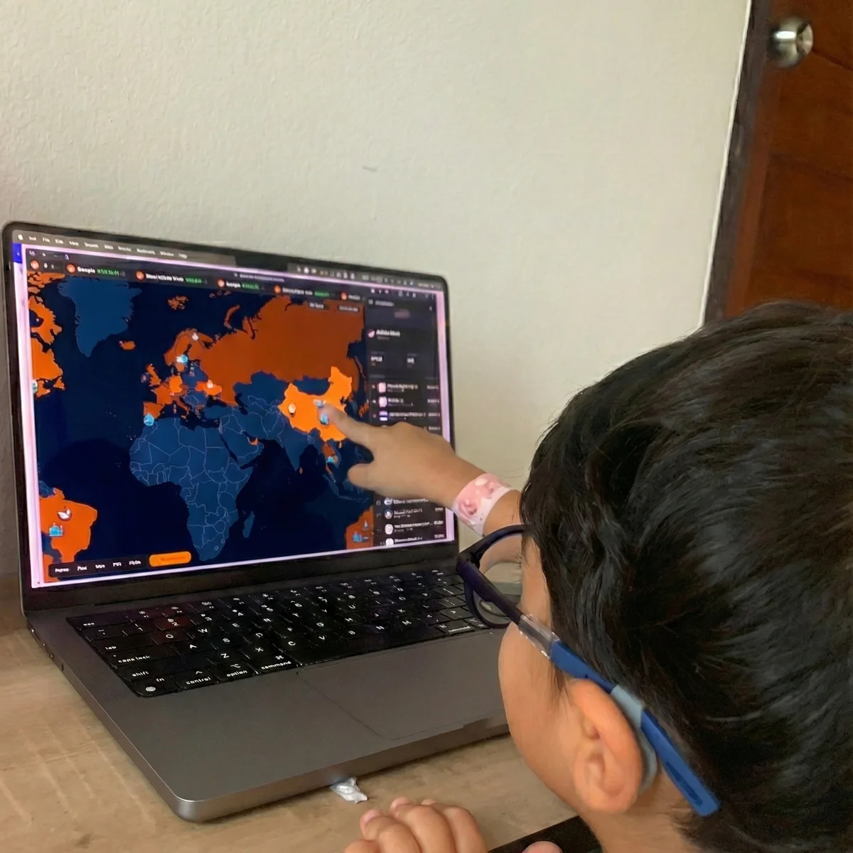My kid exploring Bitcoin Companies map on a laptop